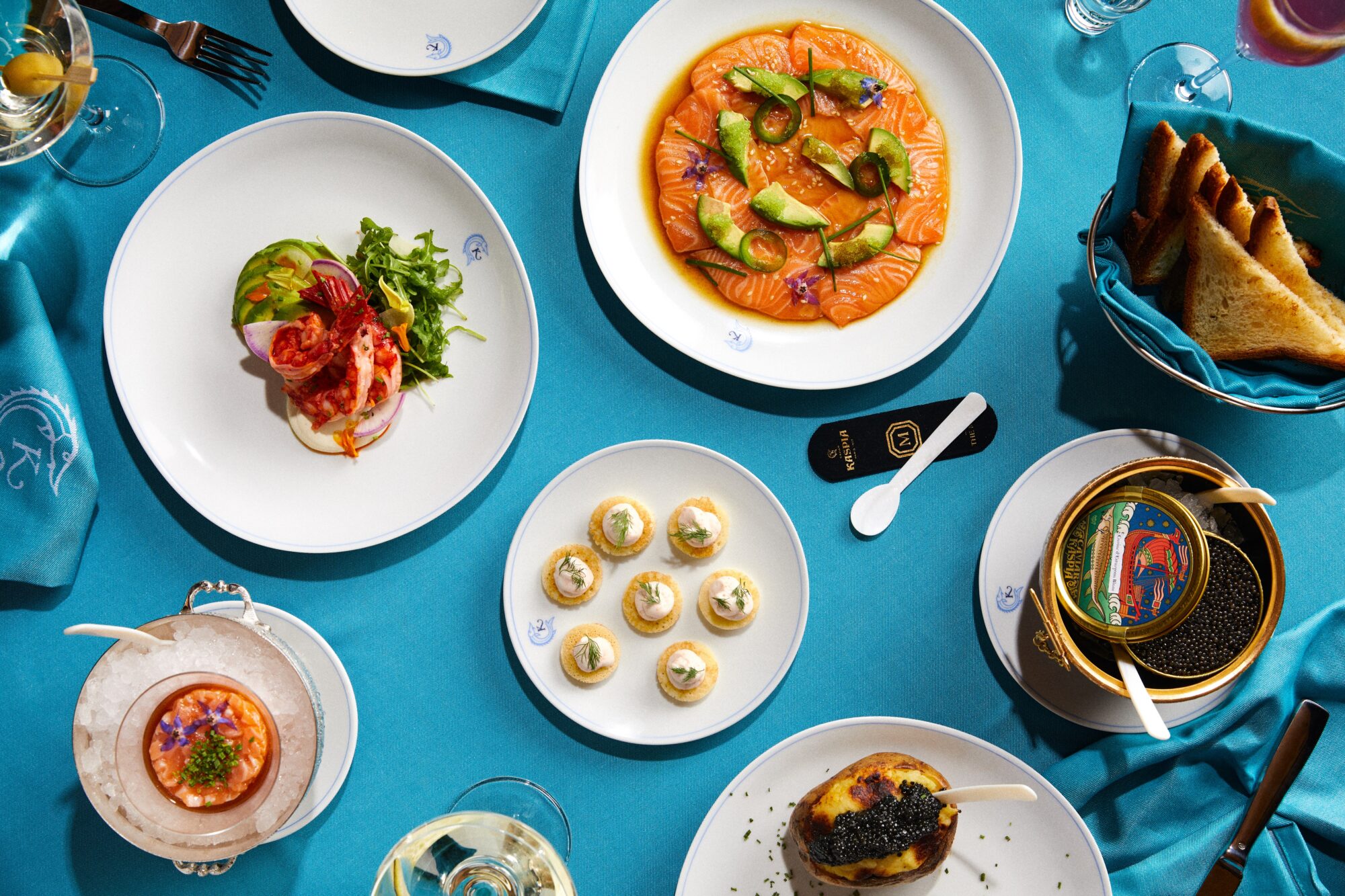 A table set with various dishes of food.